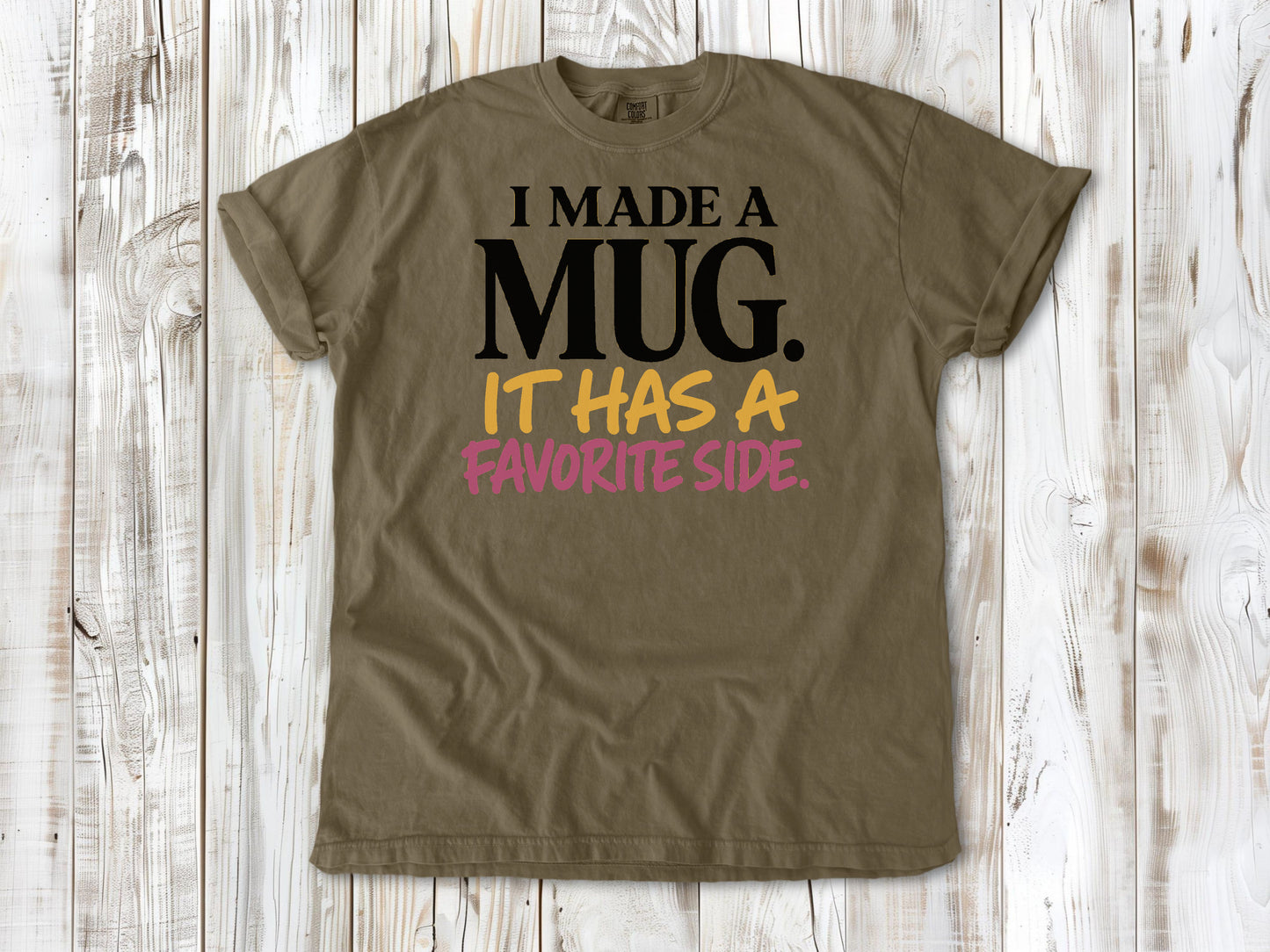 Graphite garment-dyed tee with I Made a Mug It Has a Favorite Side pottery graphic.