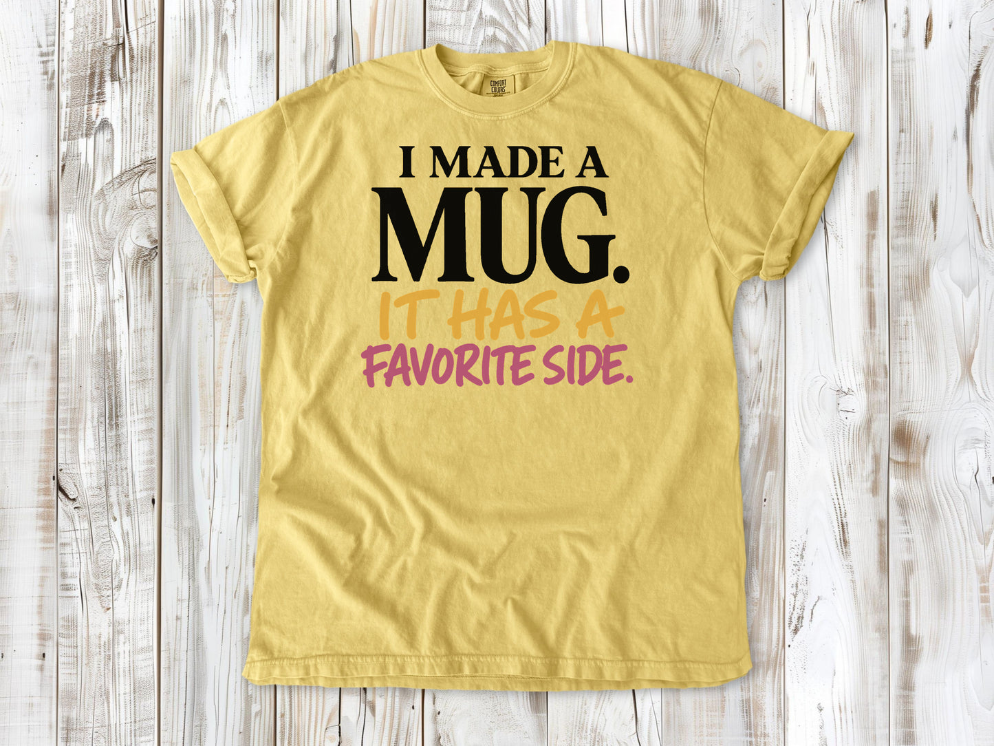 Grey garment-dyed tee with I Made a Mug It Has a Favorite Side pottery graphic.