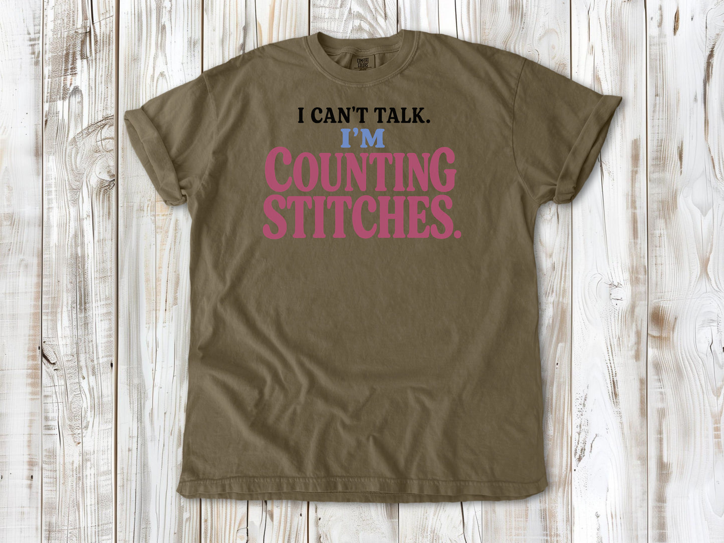 Graphite garment-dyed tee with I Can't Talk I'm Counting Stitches knitting and crochet graphic.
