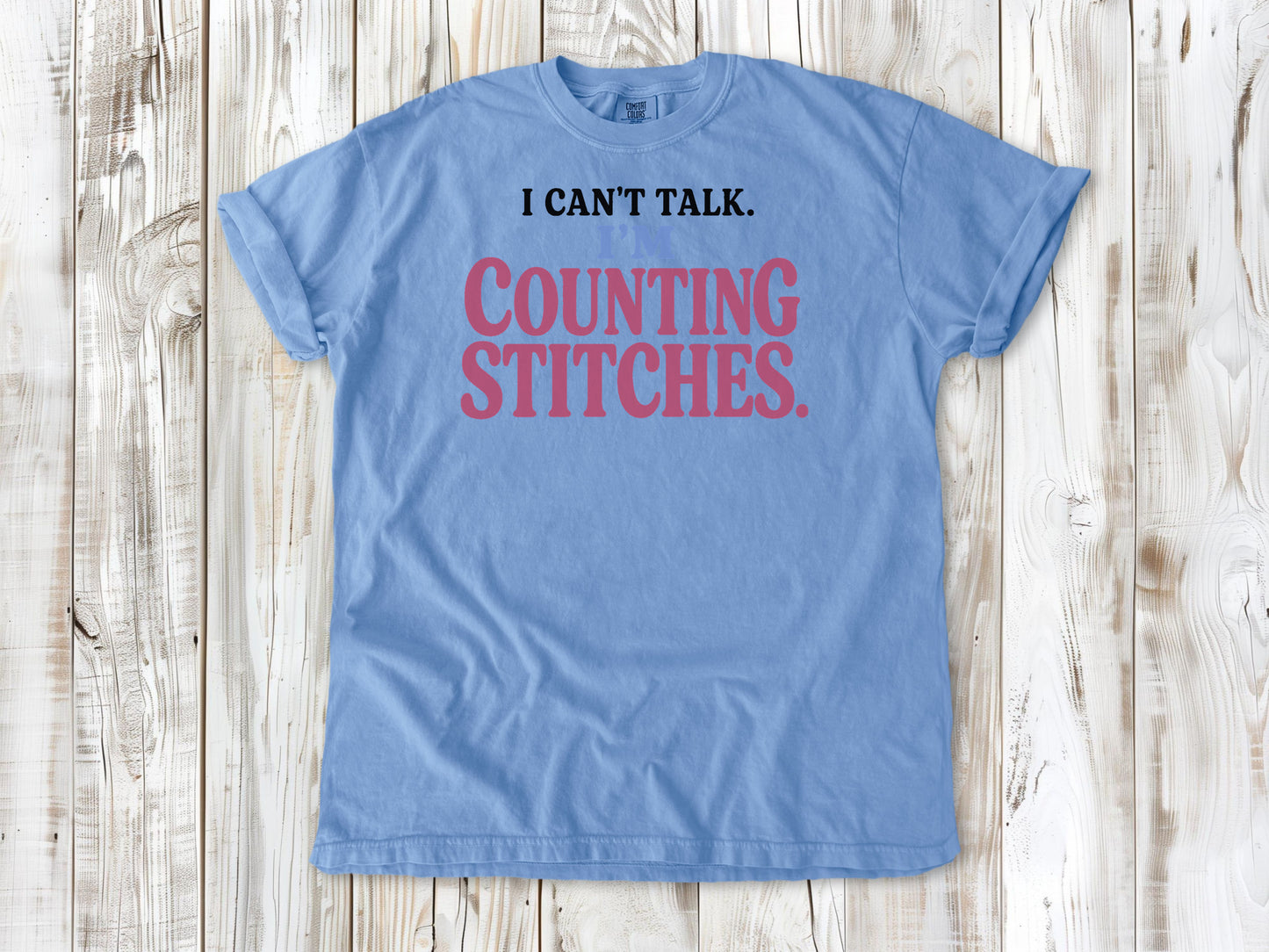 Pepper garment-dyed tee with I Can't Talk I'm Counting Stitches knitting and crochet graphic.