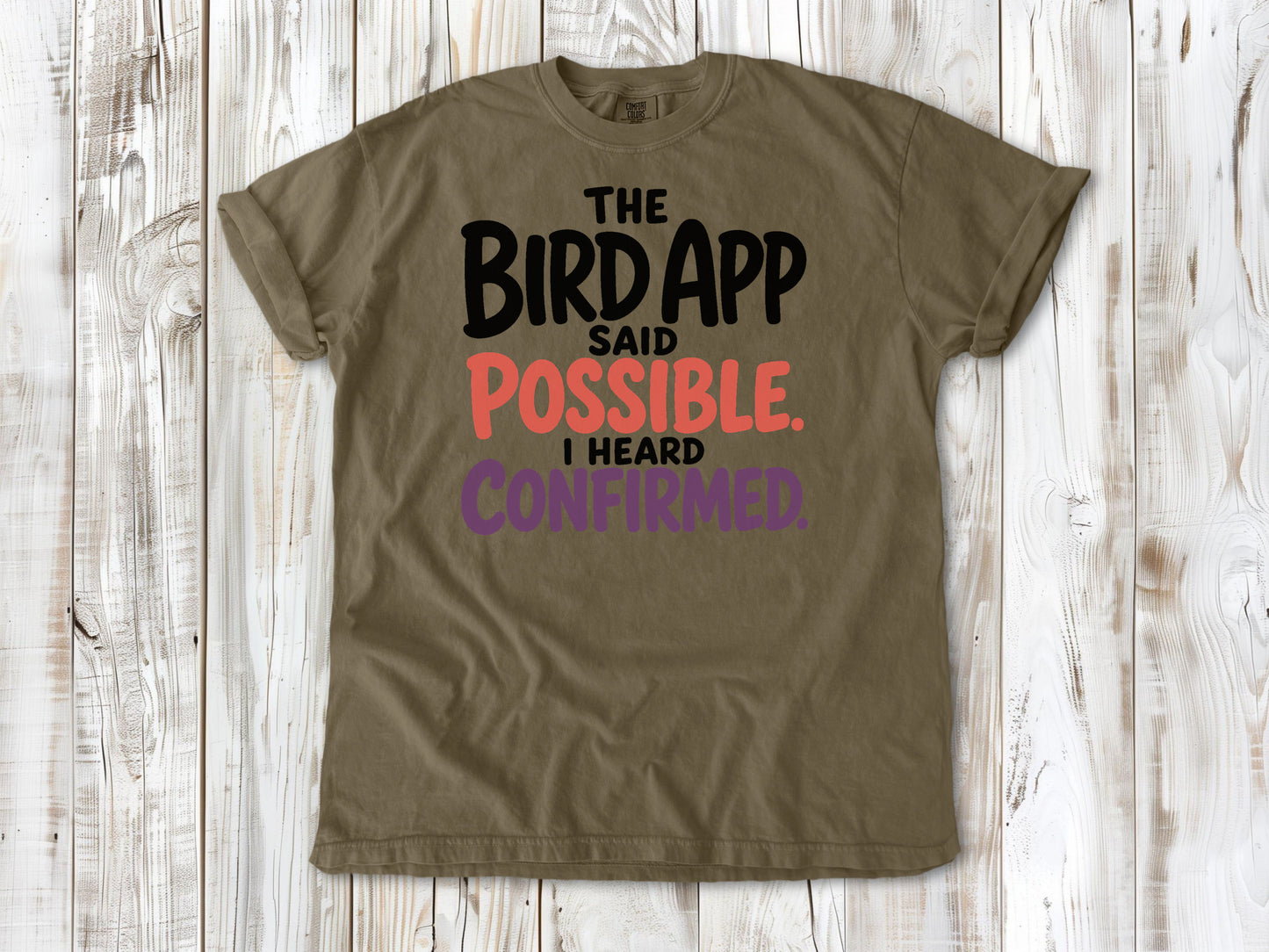 Graphite garment-dyed tee with The Bird App Said Possible I Heard Confirmed birding graphic.