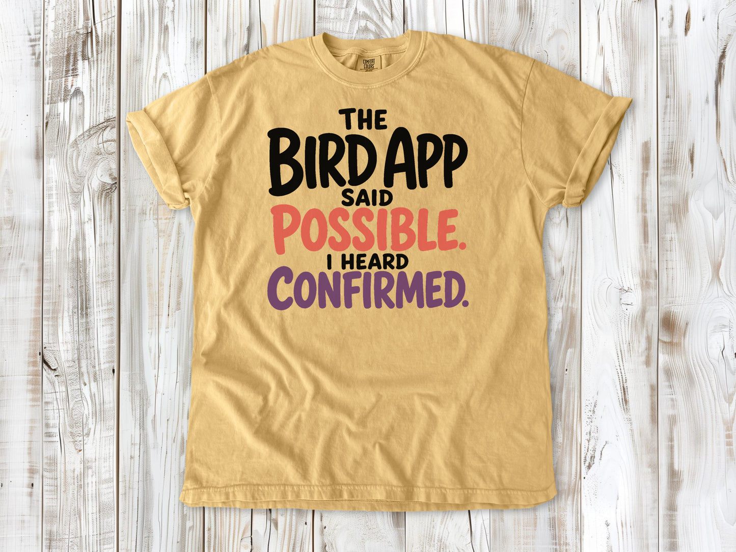 Burnt Orange garment-dyed tee with The Bird App Said Possible I Heard Confirmed birding graphic.