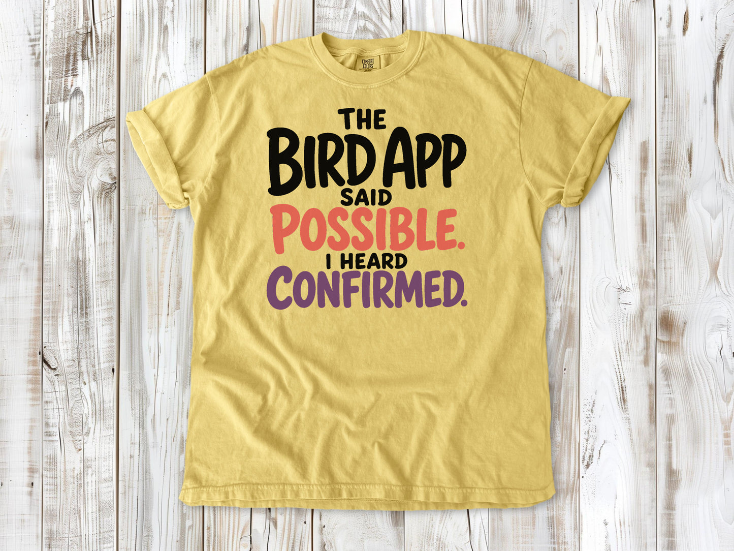 Grey garment-dyed tee with The Bird App Said Possible I Heard Confirmed birding graphic.