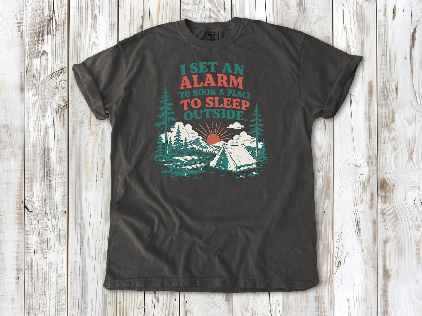 Pepper garment-dyed tee with I Set an Alarm to Book a Place to Sleep Outside camping graphic.