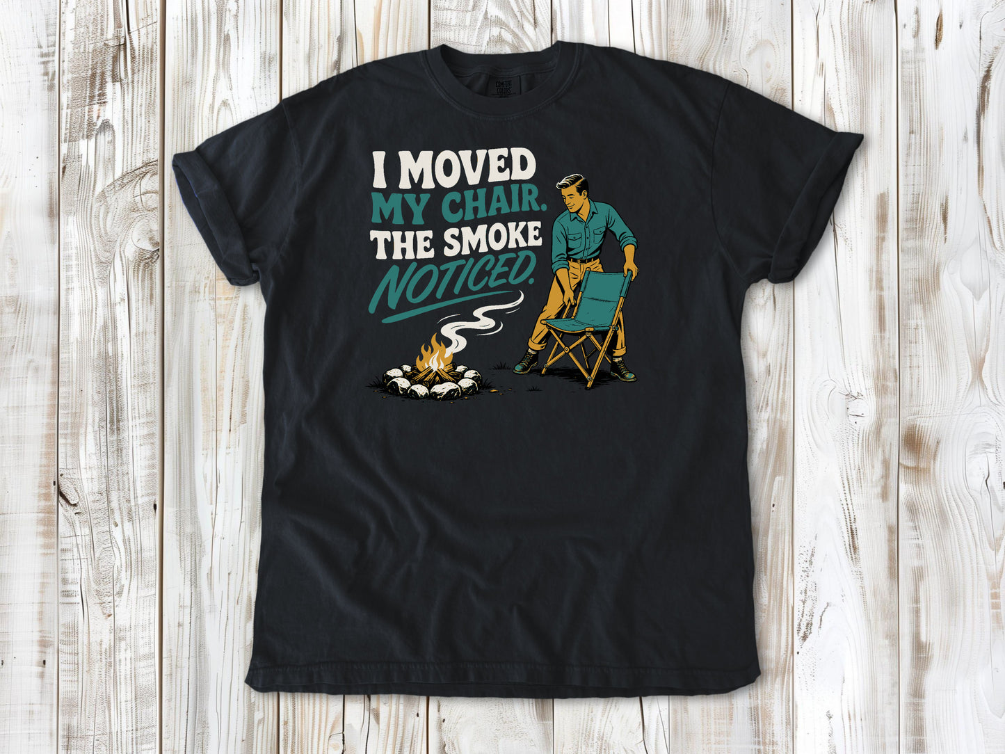 Washed Denim garment-dyed tee with I Moved My Chair The Smoke Noticed campfire graphic.