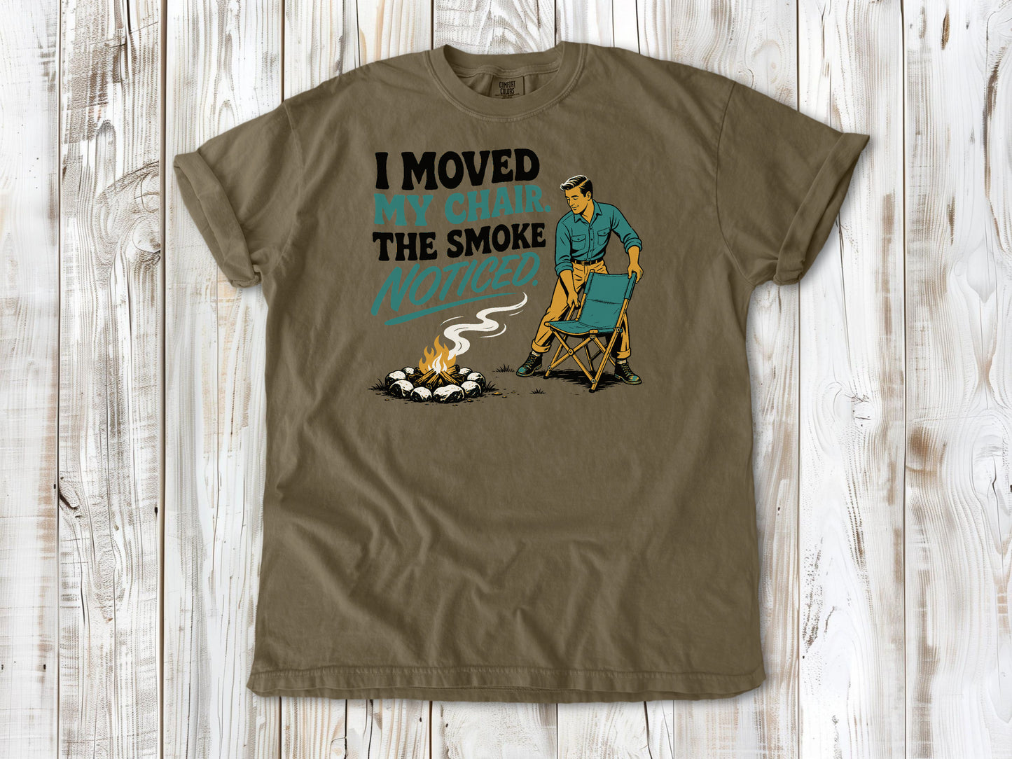 Graphite garment-dyed tee with I Moved My Chair The Smoke Noticed campfire graphic.