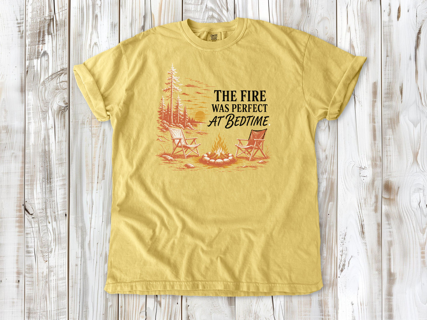 Grey garment-dyed tee with The Fire Was Perfect at Bedtime campfire graphic.