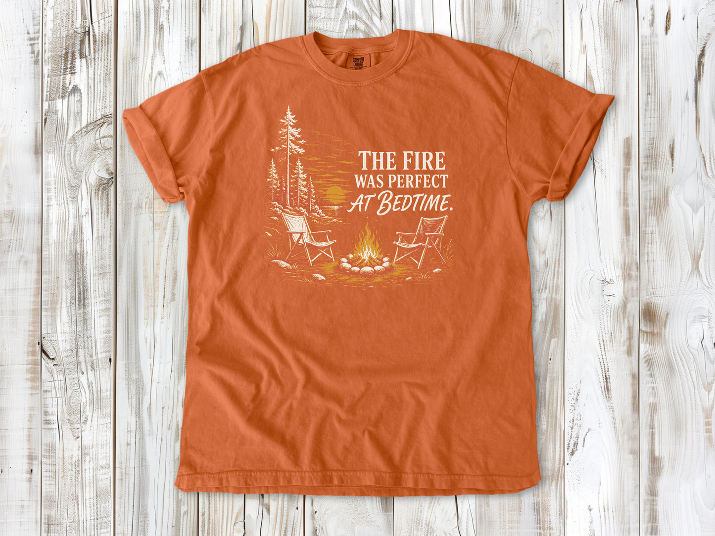Seafoam garment-dyed tee with The Fire Was Perfect at Bedtime campfire graphic.