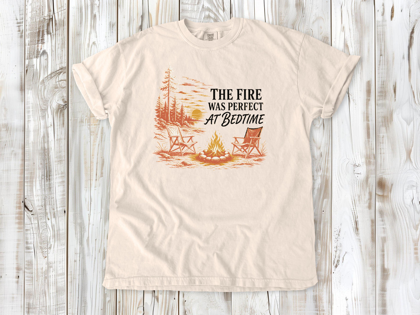 Butter garment-dyed tee with The Fire Was Perfect at Bedtime campfire graphic.