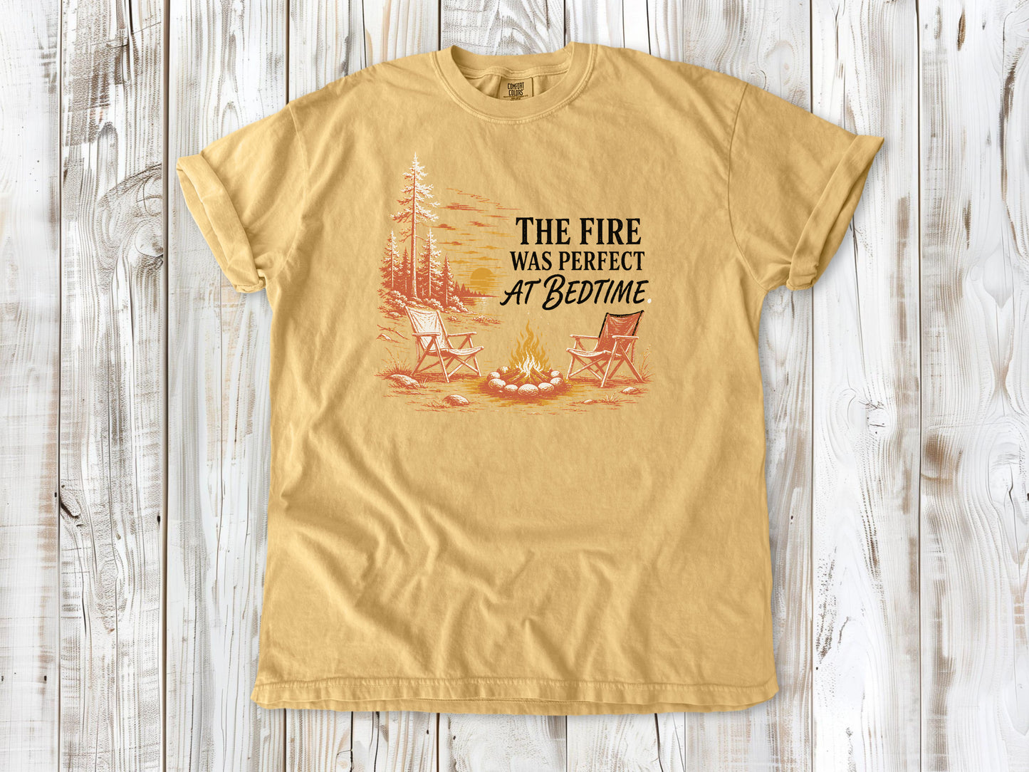 Burnt Orange garment-dyed tee with The Fire Was Perfect at Bedtime campfire graphic.
