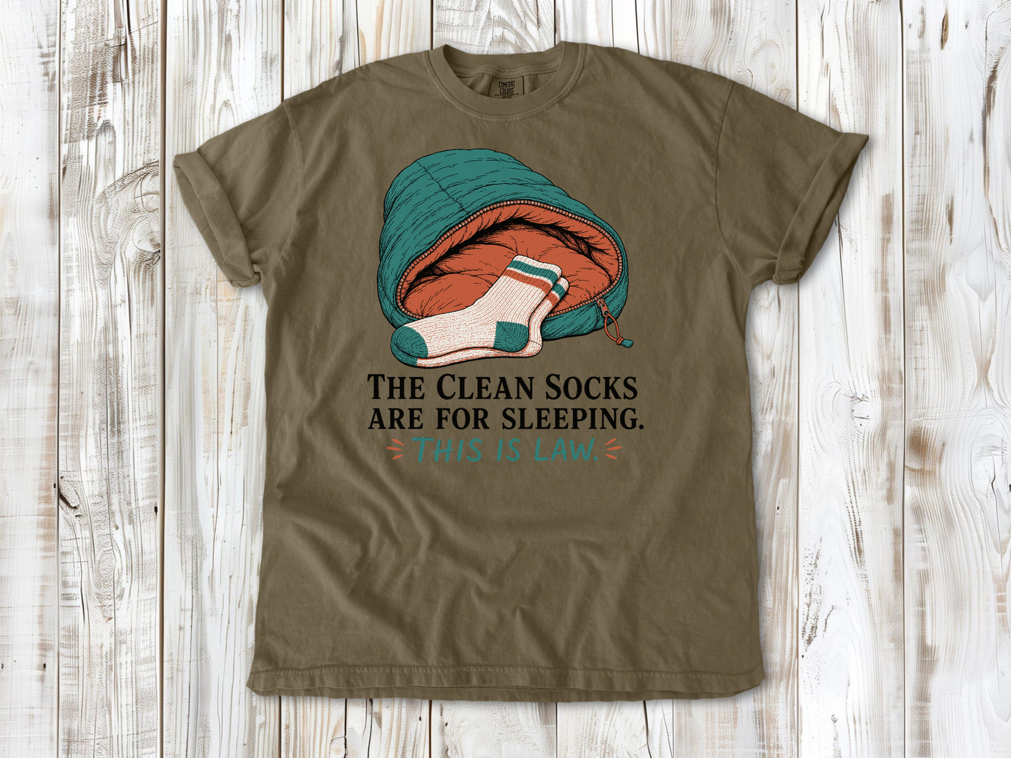 Graphite garment-dyed tee with The Clean Socks Are for Sleeping This Is Law camping graphic.