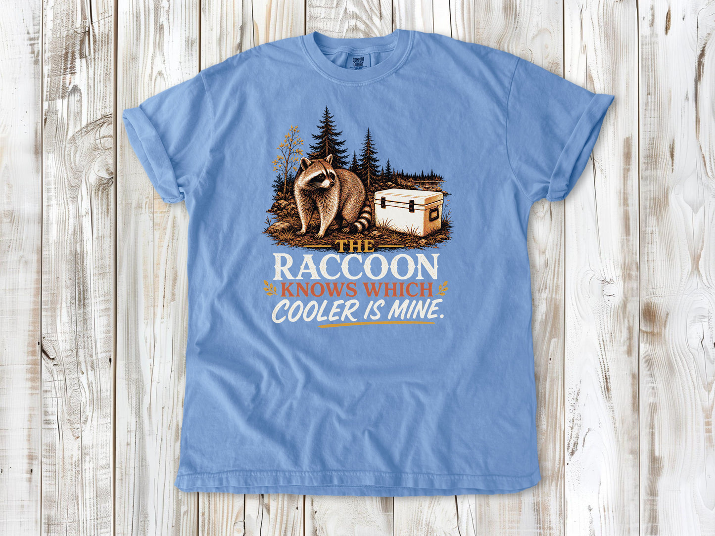 Pepper garment-dyed tee with The Raccoon Knows Which Cooler Is Mine camping graphic.