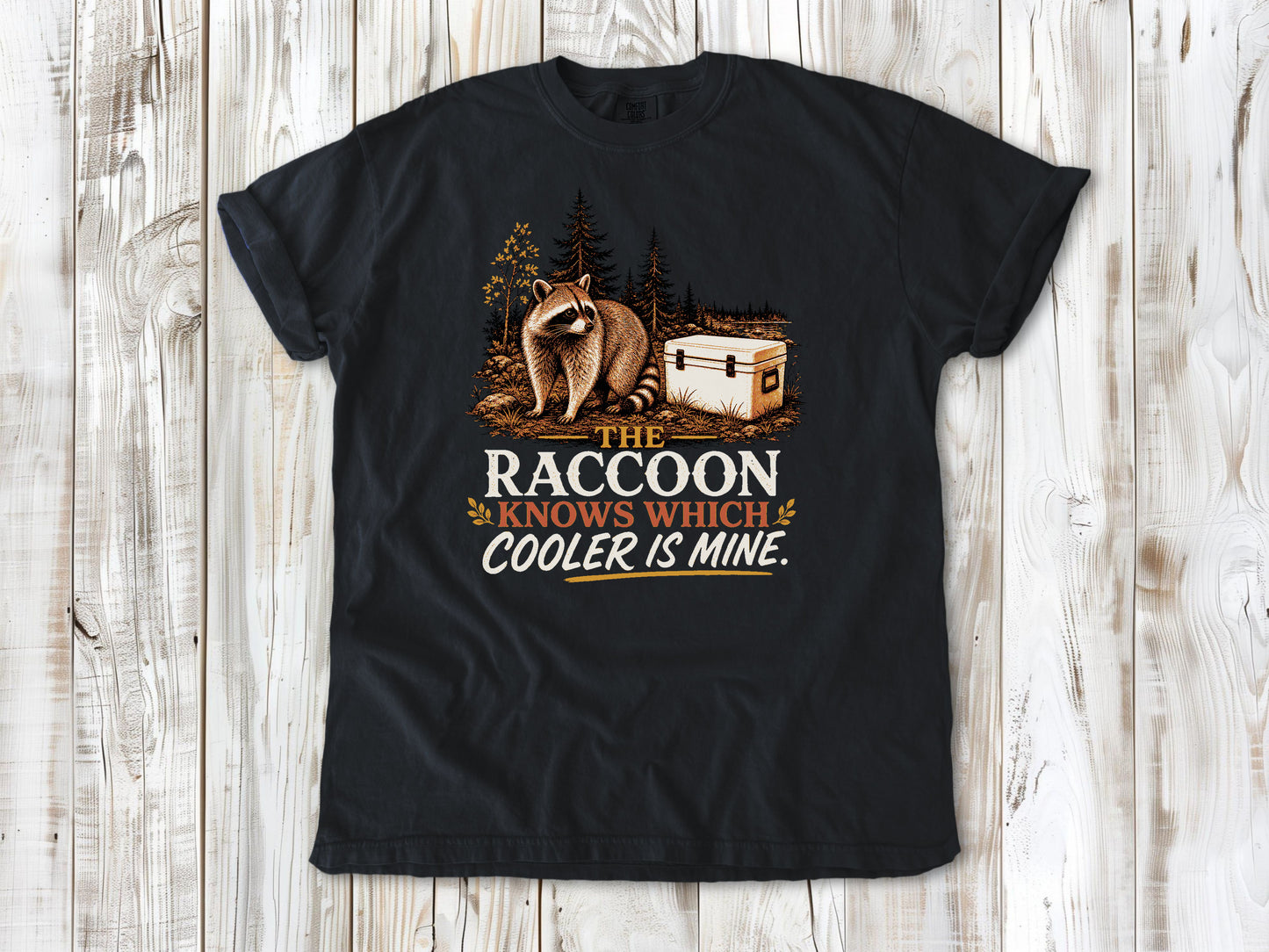Washed Denim garment-dyed tee with The Raccoon Knows Which Cooler Is Mine camping graphic.