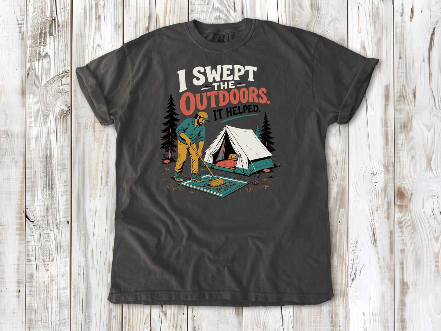 Ivory garment-dyed tee with I Swept the Outdoors It Helped camping graphic.