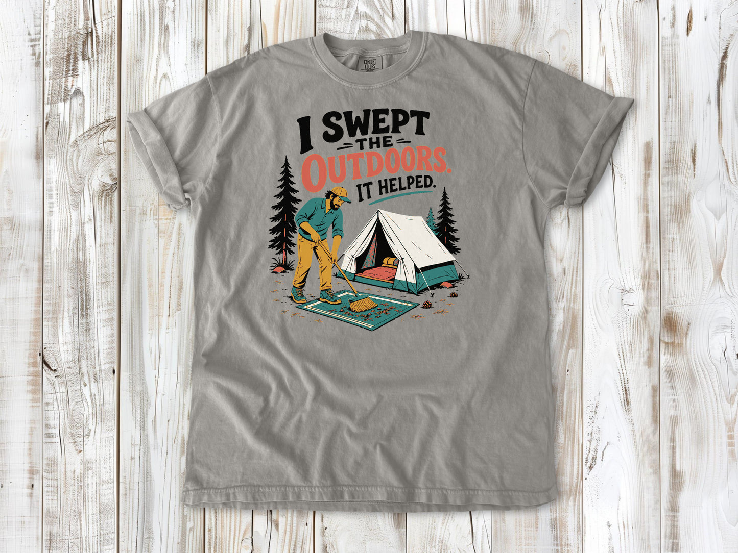 Khaki garment-dyed tee with I Swept the Outdoors It Helped camping graphic.