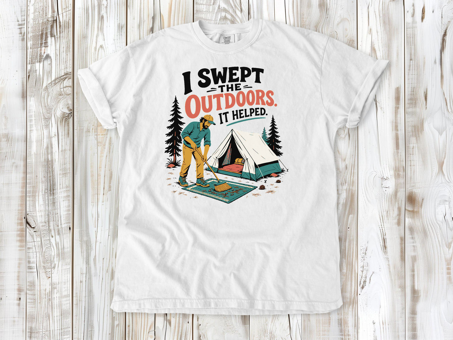 White garment-dyed tee with I Swept the Outdoors It Helped camping graphic.