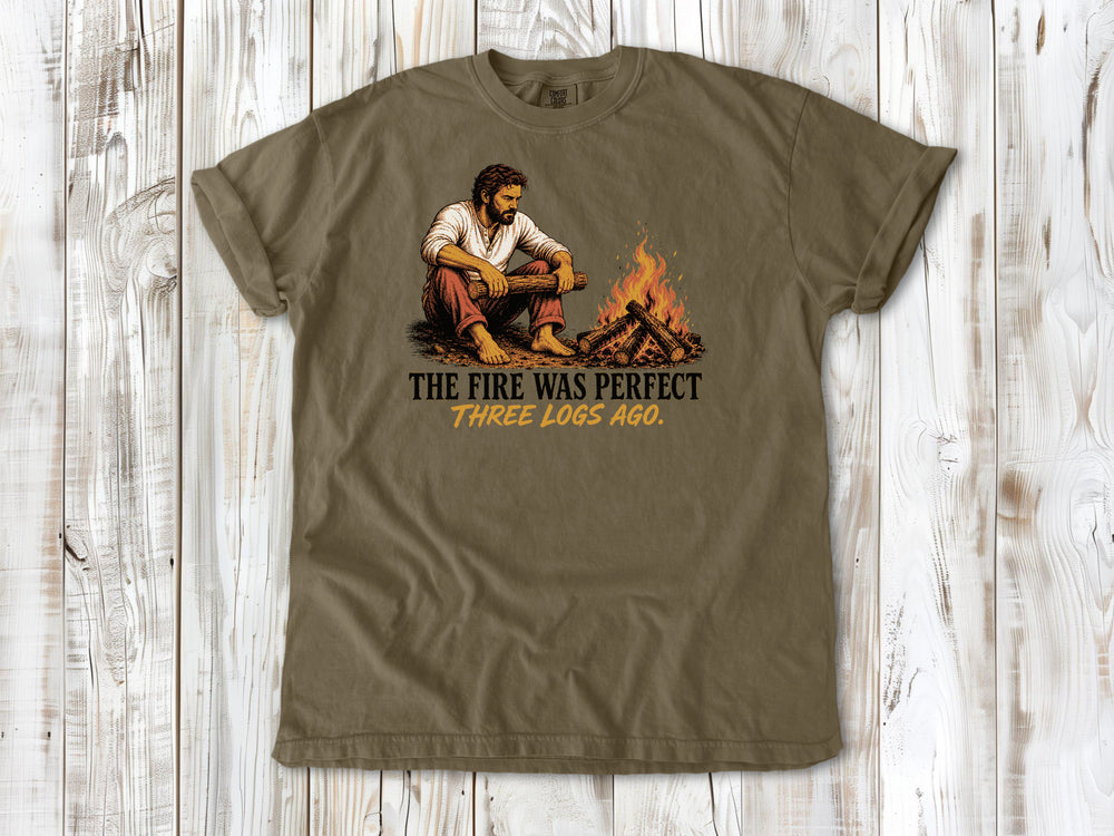 Graphite garment-dyed tee with The Fire Was Perfect Three Logs Ago beach bonfire graphic.