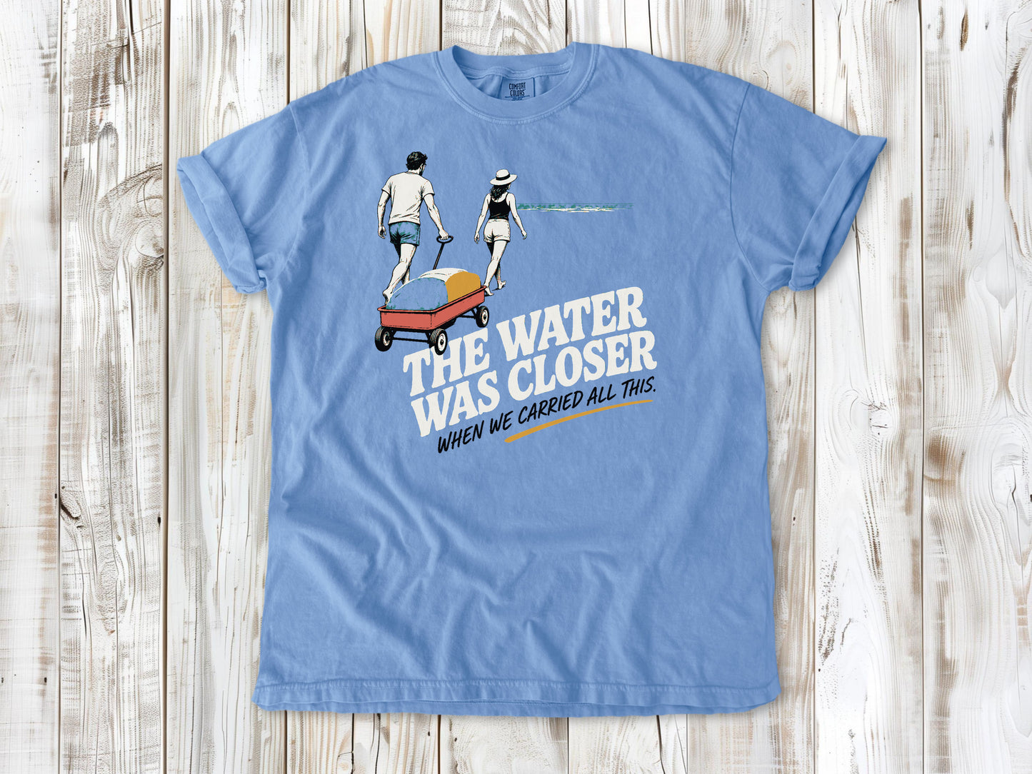 Pepper garment-dyed tee with The Water Was Closer When We Carried All This beach graphic.