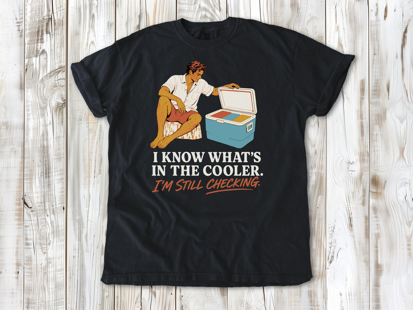 Washed Denim garment-dyed tee with I Know What's in the Cooler I'm Still Checking beach graphic.