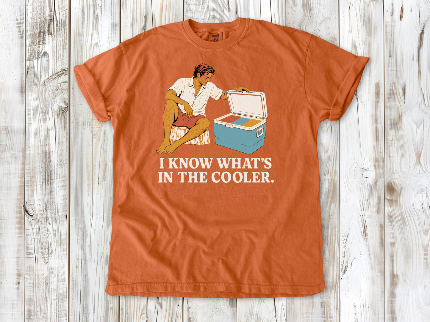 Seafoam garment-dyed tee with I Know What's in the Cooler I'm Still Checking beach graphic.