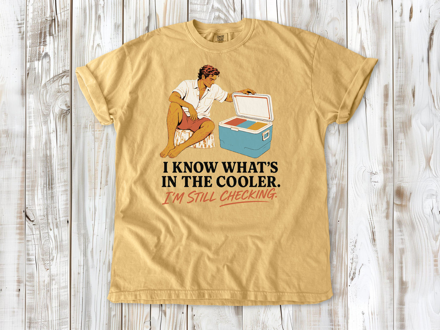 Burnt Orange garment-dyed tee with I Know What's in the Cooler I'm Still Checking beach graphic.