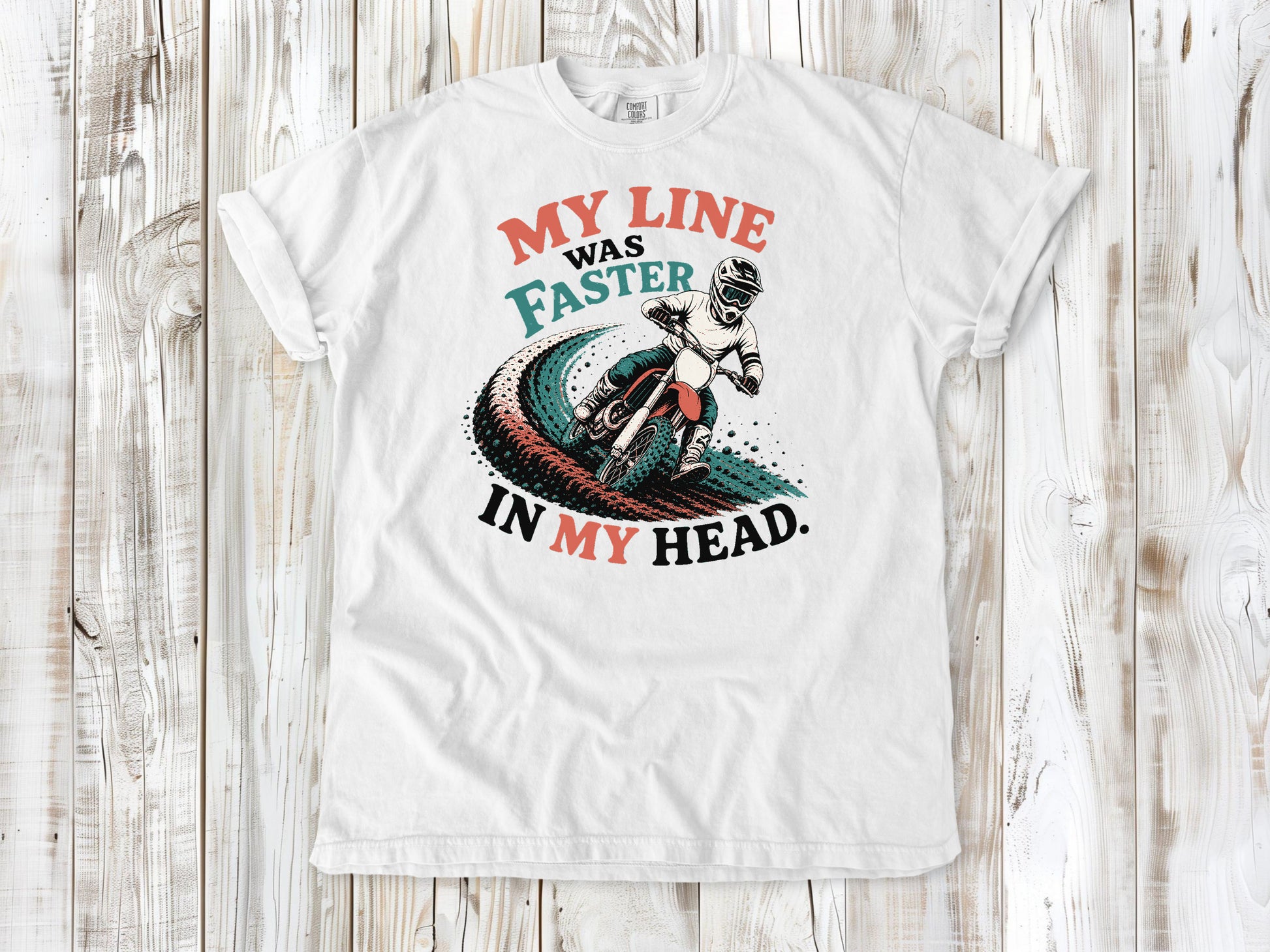 White garment-dyed tee with My Line Was Faster in My Head motocross rider graphic.