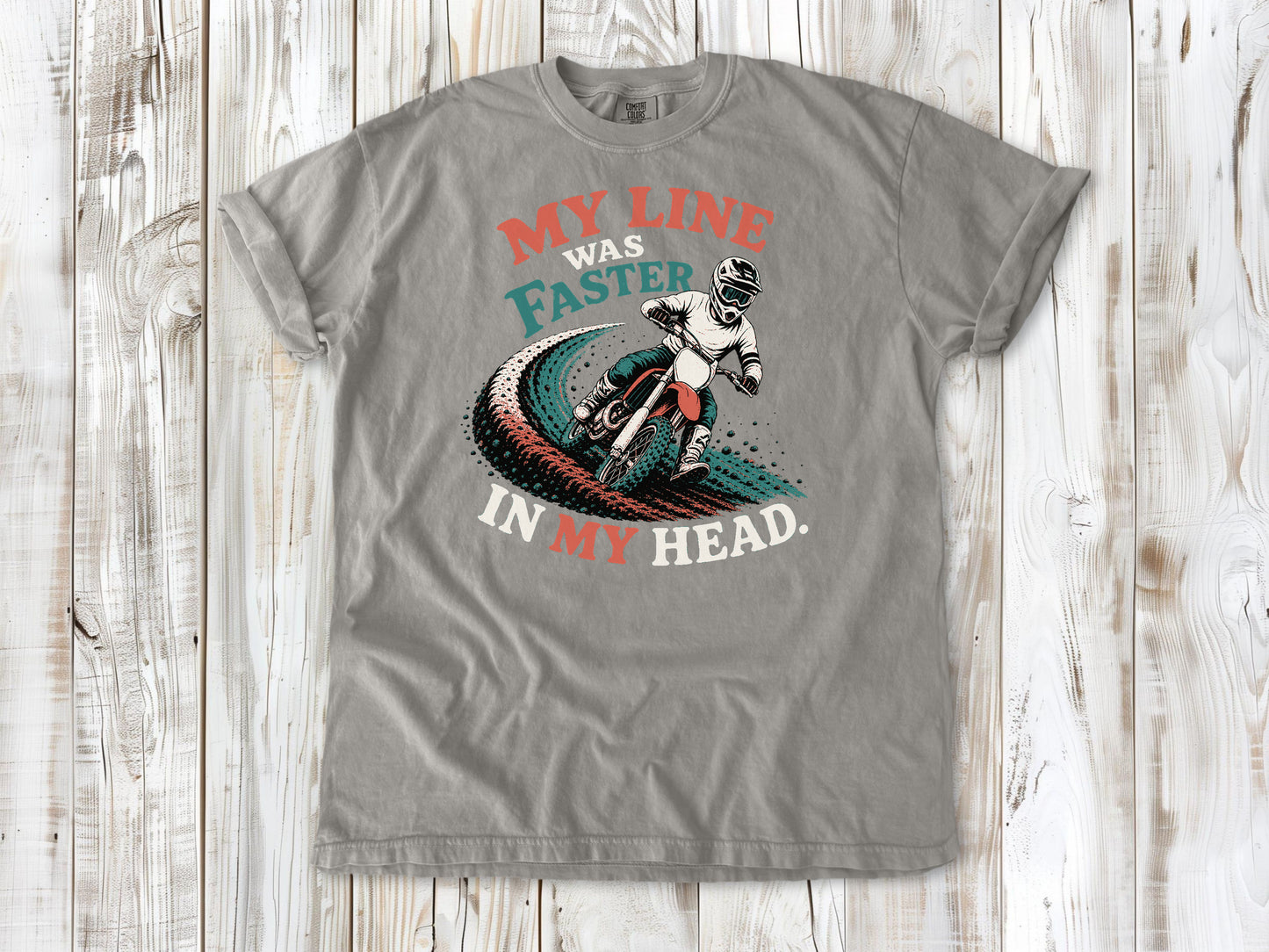 Grey garment-dyed tee with My Line Was Faster in My Head motocross rider graphic.