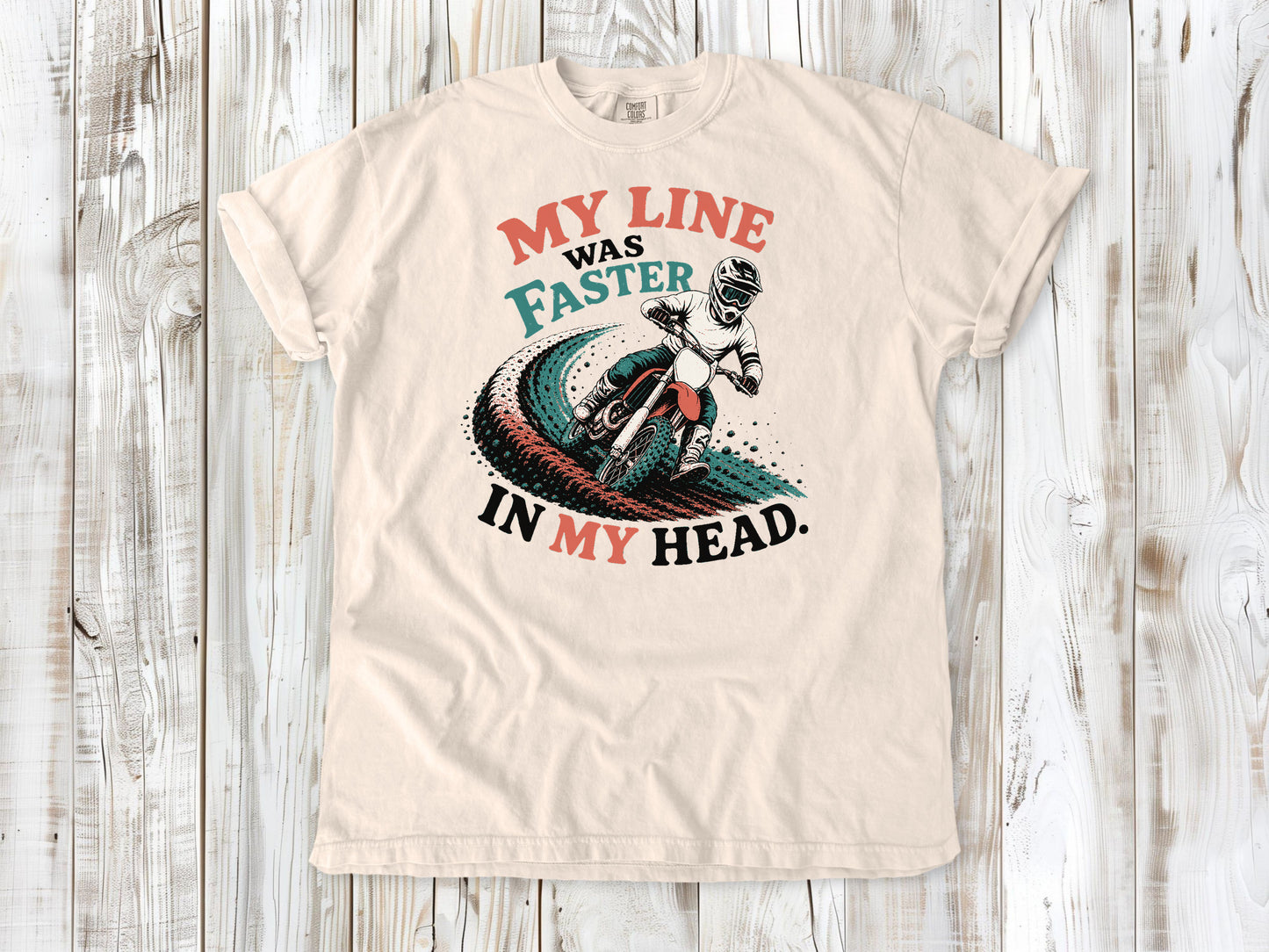 Ivory garment-dyed tee with My Line Was Faster in My Head motocross rider graphic.