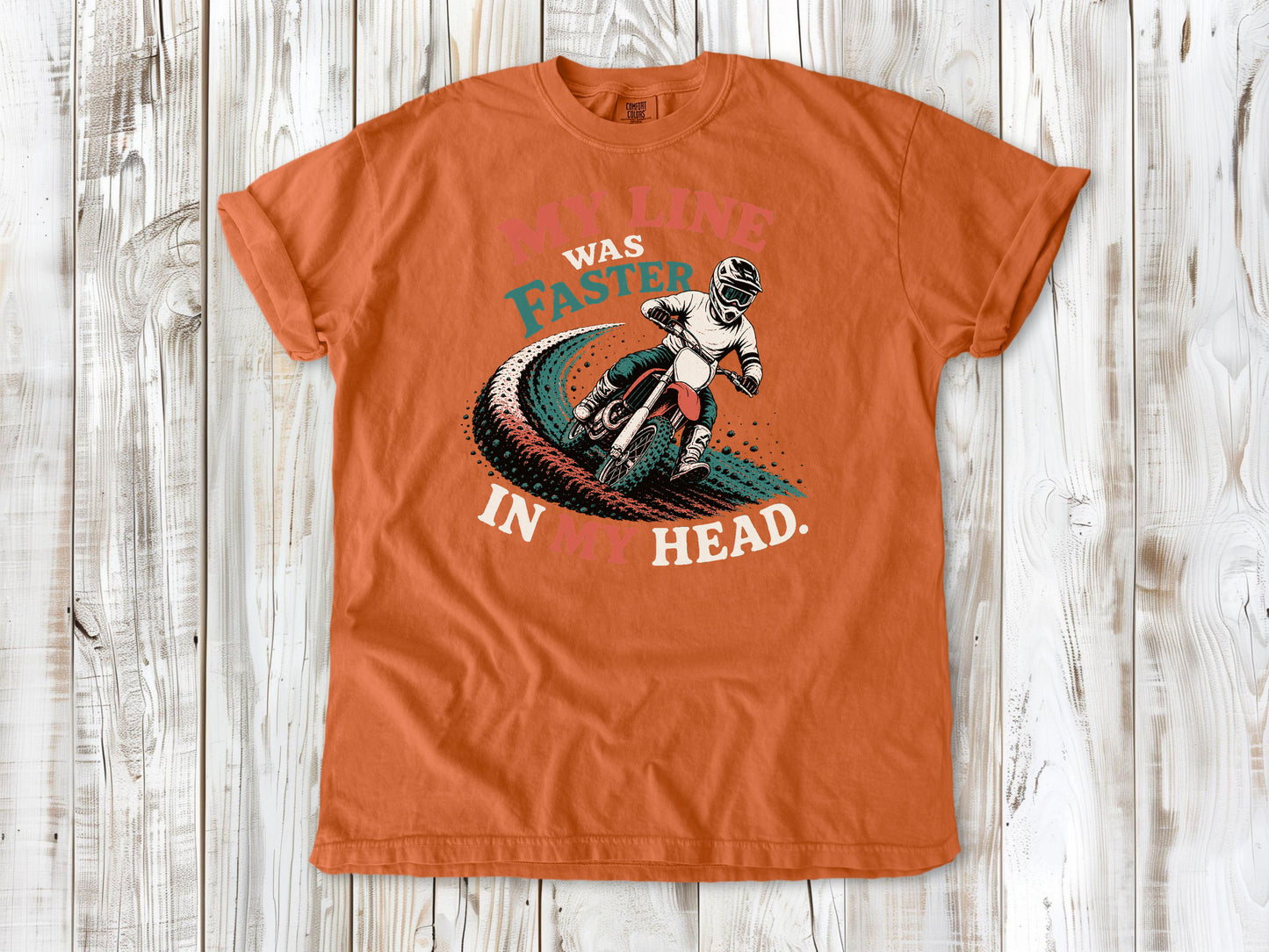 Burnt Orange garment-dyed tee with My Line Was Faster in My Head motocross rider graphic.