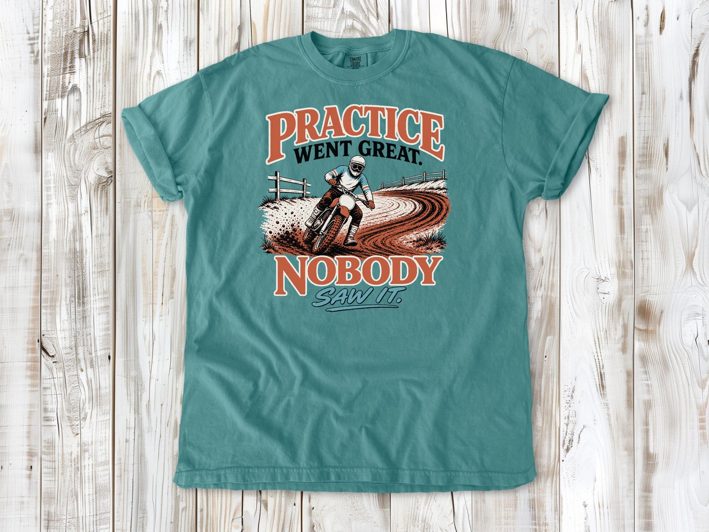Seafoam garment-dyed tee with Practice Went Great Nobody Saw It motocross graphic.