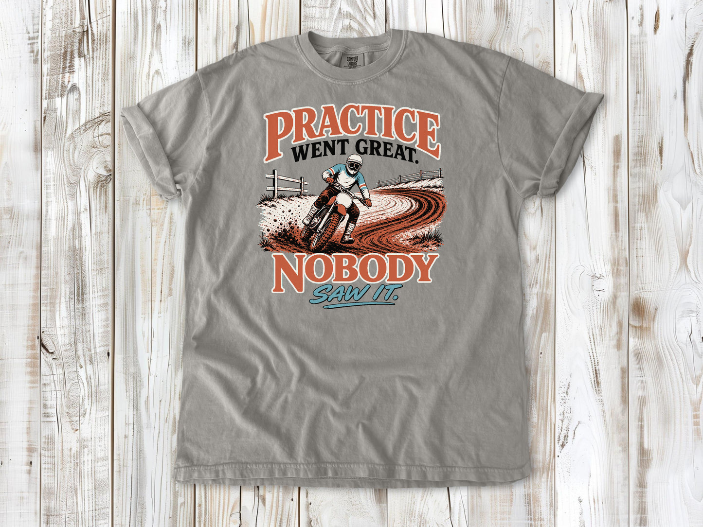 Grey garment-dyed tee with Practice Went Great Nobody Saw It motocross graphic.