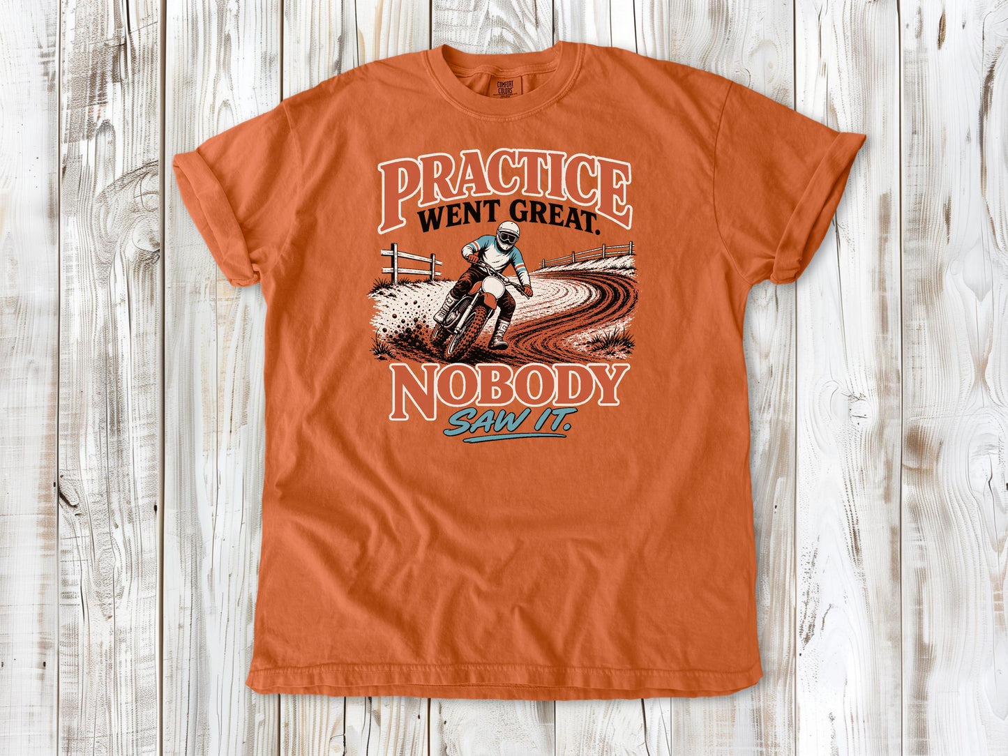Burnt Orange garment-dyed tee with Practice Went Great Nobody Saw It motocross graphic.