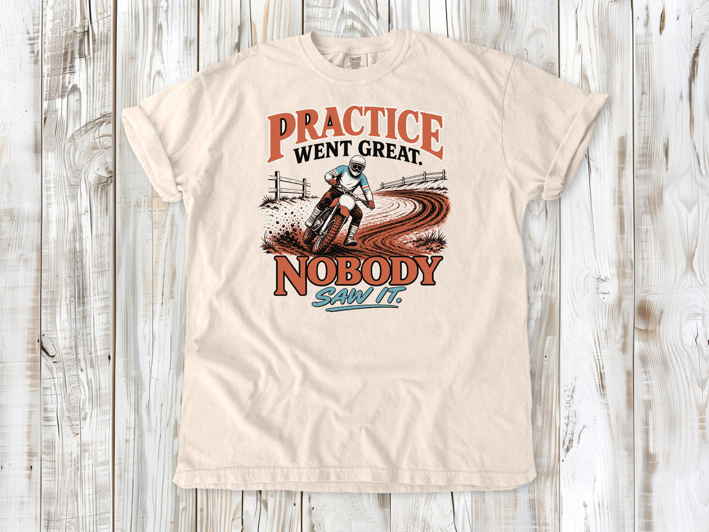 Ivory garment-dyed tee with Practice Went Great Nobody Saw It motocross graphic.