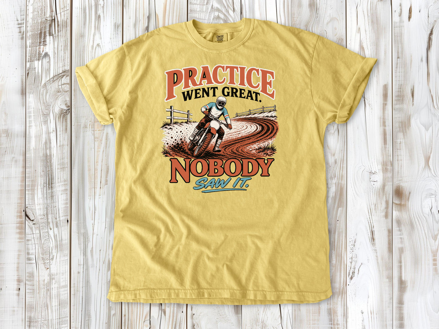 Butter garment-dyed tee with Practice Went Great Nobody Saw It motocross graphic.