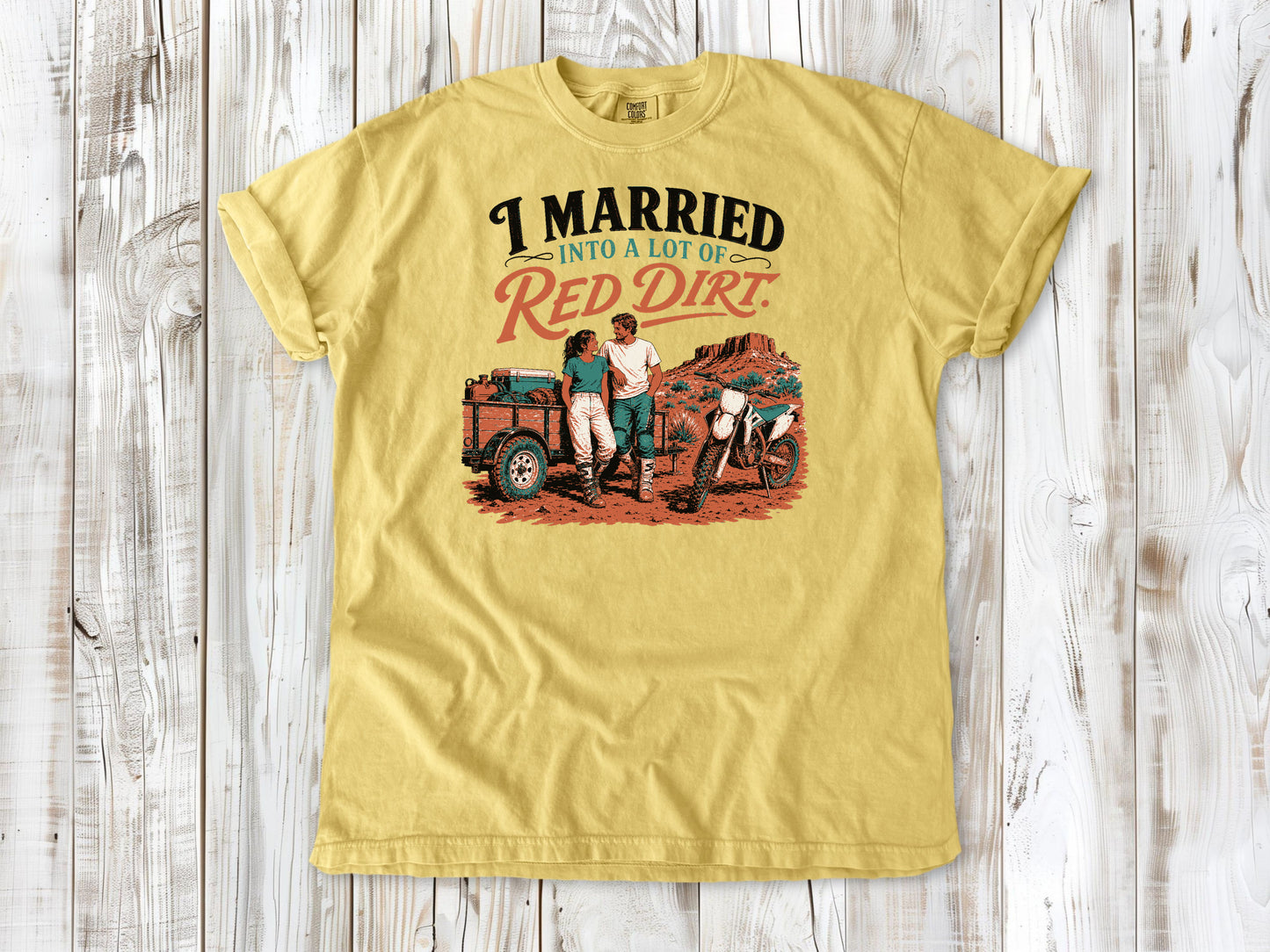 Butter garment-dyed tee with I Married Into a Lot of Red Dirt motocross couple graphic.
