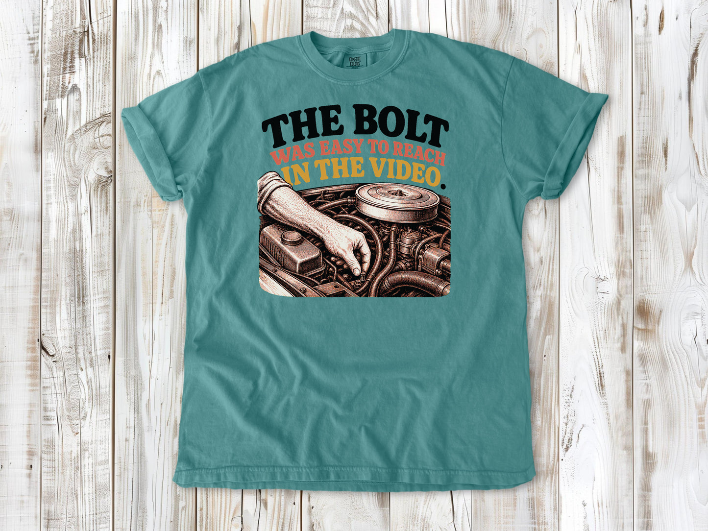 Seafoam garment-dyed tee with The Bolt Was Easy to Reach in the Video mechanic graphic.
