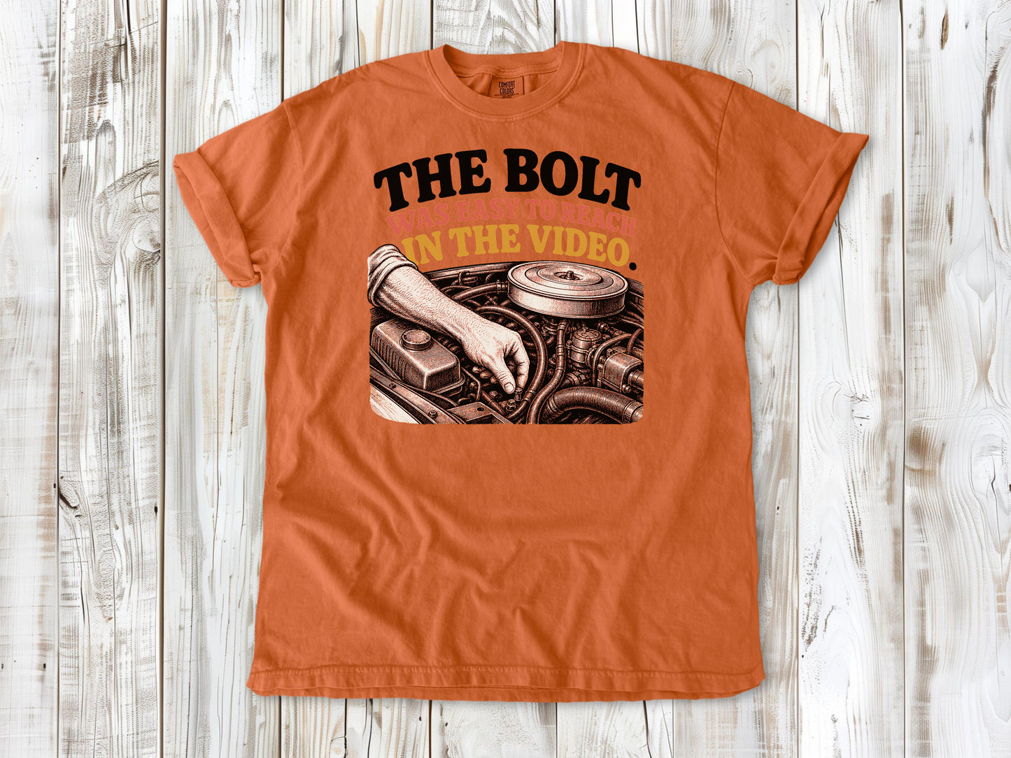 Burnt Orange garment-dyed tee with The Bolt Was Easy to Reach in the Video mechanic graphic.