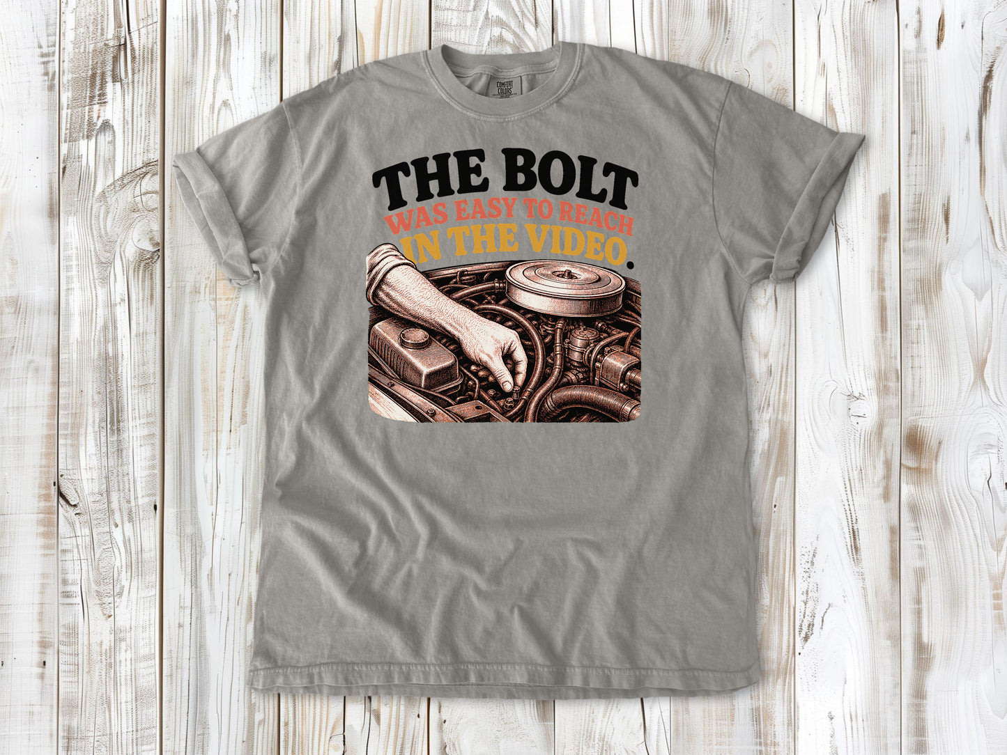 Grey garment-dyed tee with The Bolt Was Easy to Reach in the Video mechanic graphic.