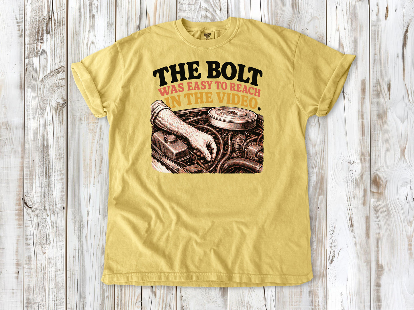 Butter garment-dyed tee with The Bolt Was Easy to Reach in the Video mechanic graphic.
