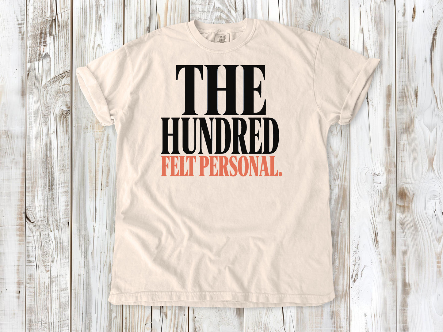 Ivory garment-dyed tee with The Hundred Felt Personal Pilates exercise graphic.