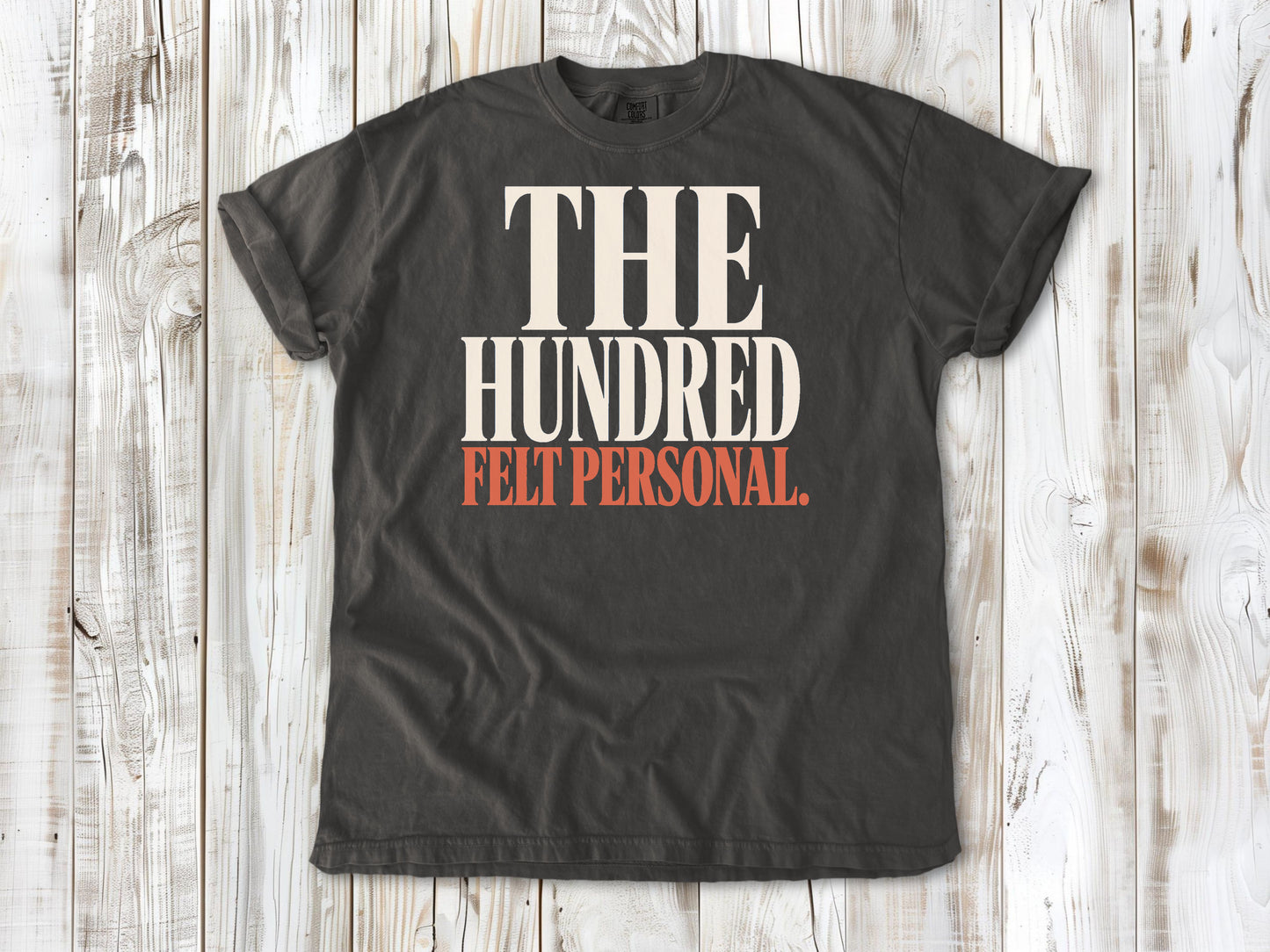 Pepper garment-dyed tee with The Hundred Felt Personal Pilates exercise graphic.