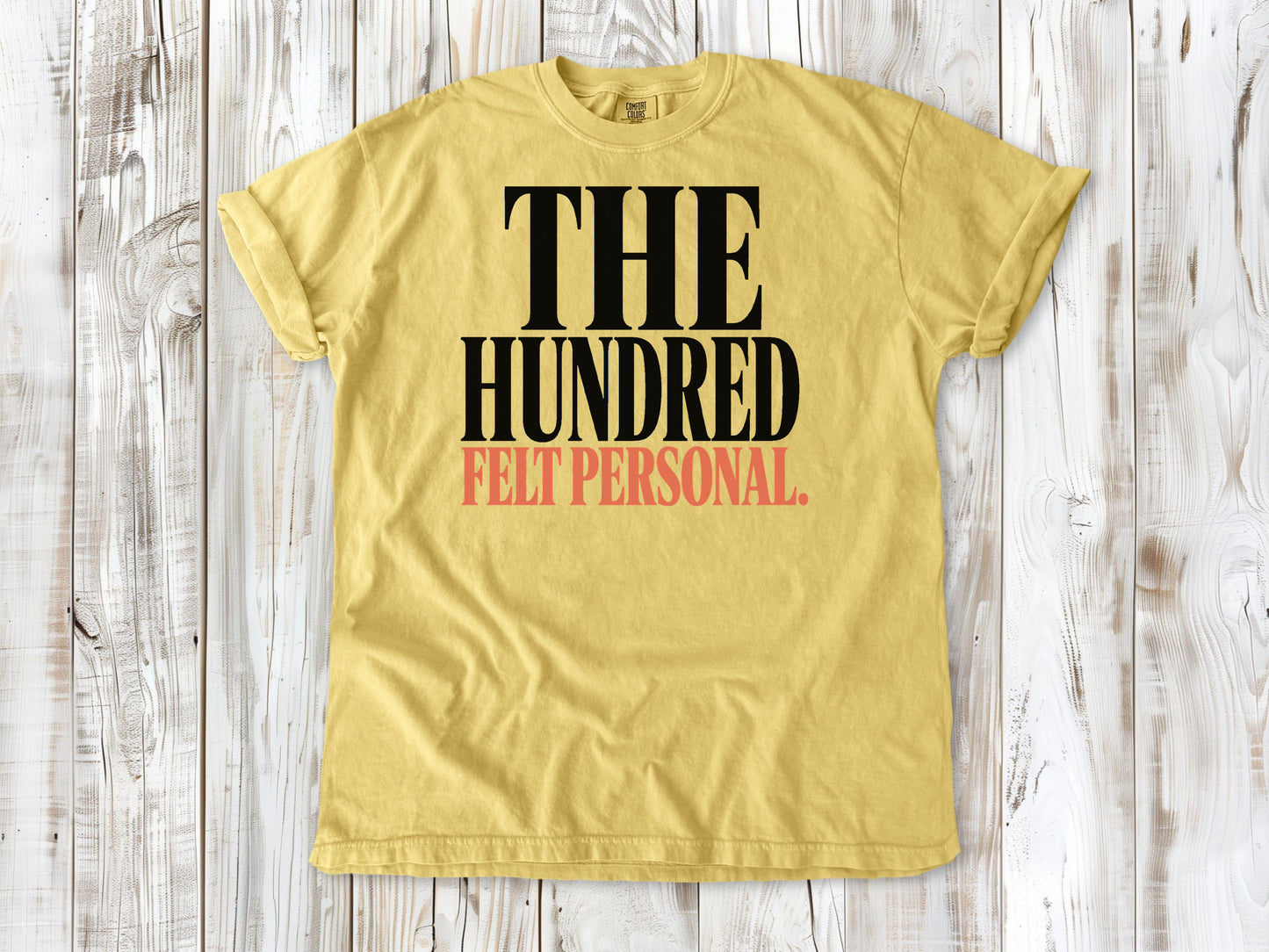 Butter garment-dyed tee with The Hundred Felt Personal Pilates exercise graphic.