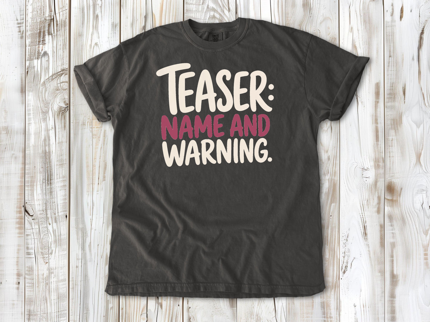 Pepper garment-dyed tee with Teaser Name and Warning Pilates exercise graphic.