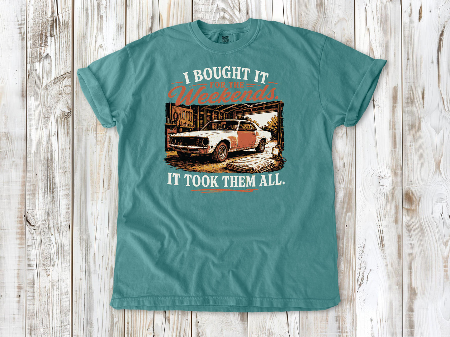 Seafoam garment-dyed tee with I Bought It for the Weekends It Took Them All project car graphic.