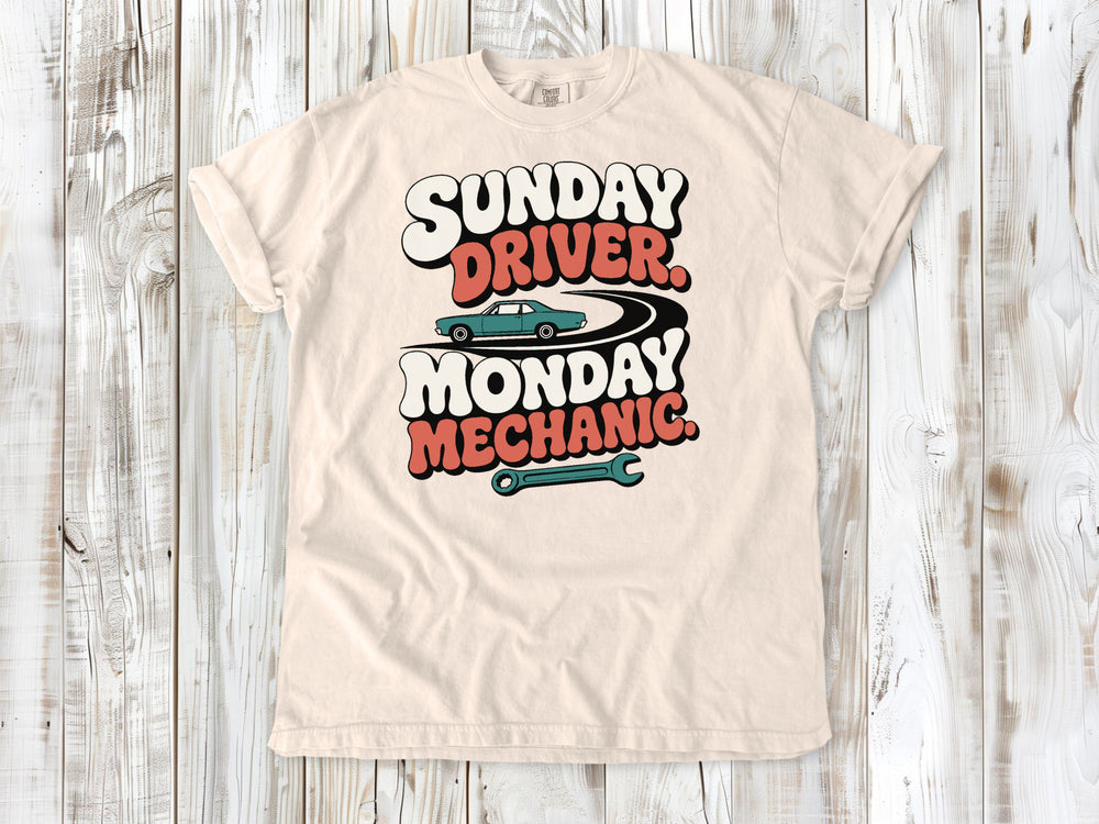 Ivory garment-dyed tee with Sunday Driver Monday Mechanic classic car graphic.