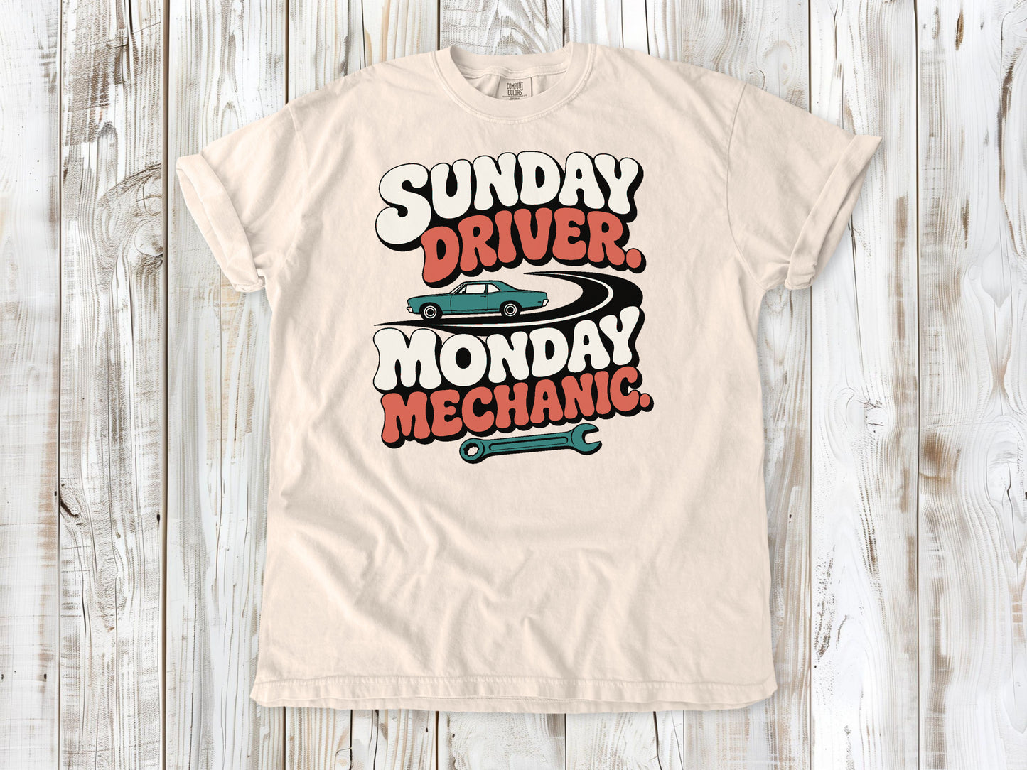 Ivory garment-dyed tee with Sunday Driver Monday Mechanic classic car graphic.