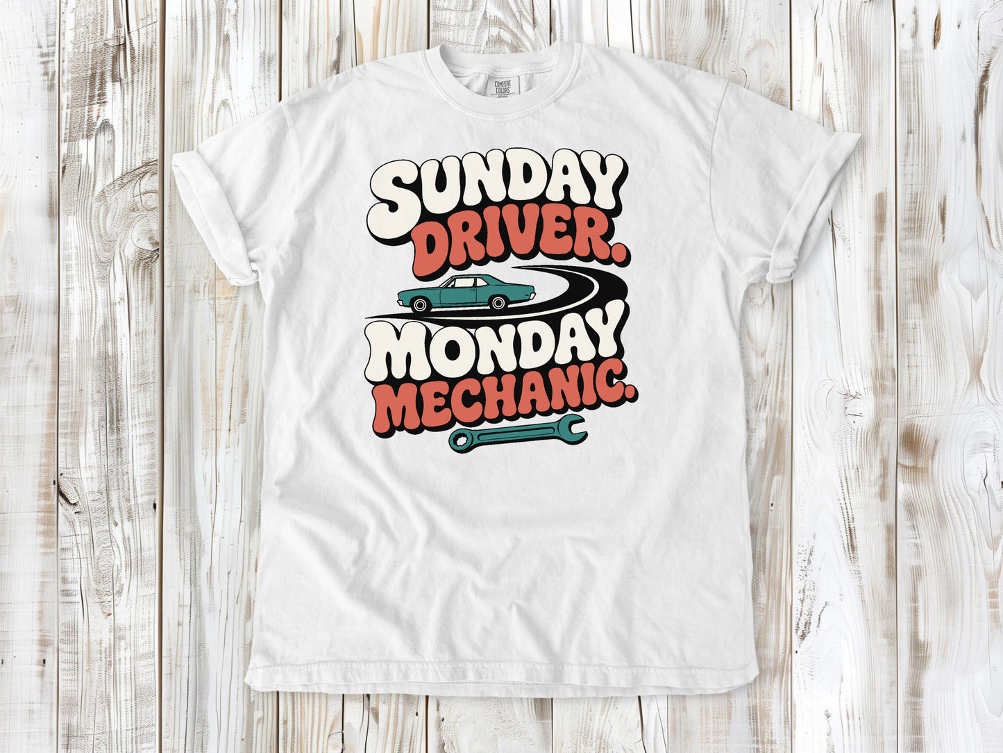 White garment-dyed tee with Sunday Driver Monday Mechanic classic car graphic.