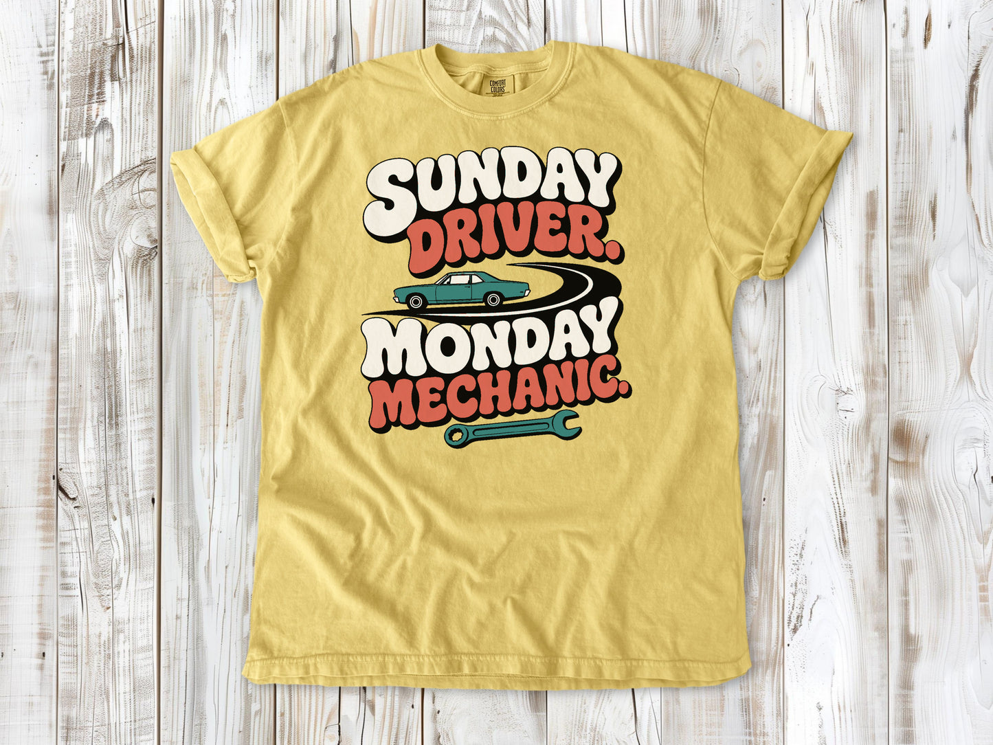 Butter garment-dyed tee with Sunday Driver Monday Mechanic classic car graphic.