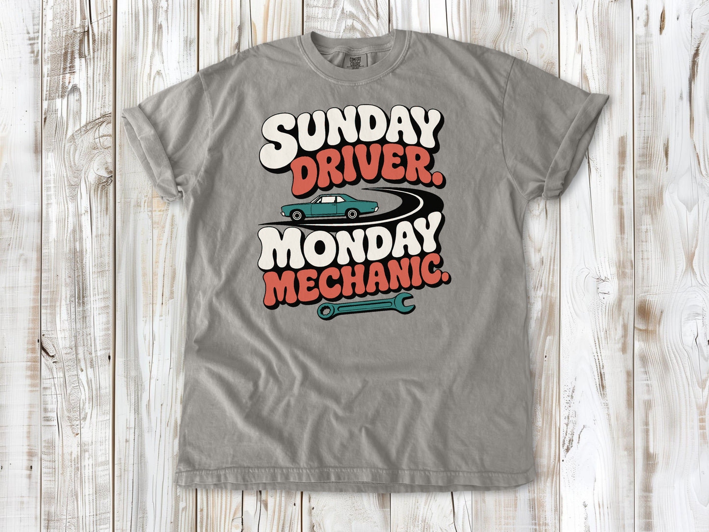 Grey garment-dyed tee with Sunday Driver Monday Mechanic classic car graphic.