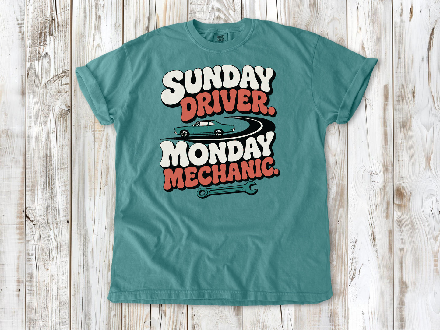 Seafoam garment-dyed tee with Sunday Driver Monday Mechanic classic car graphic.